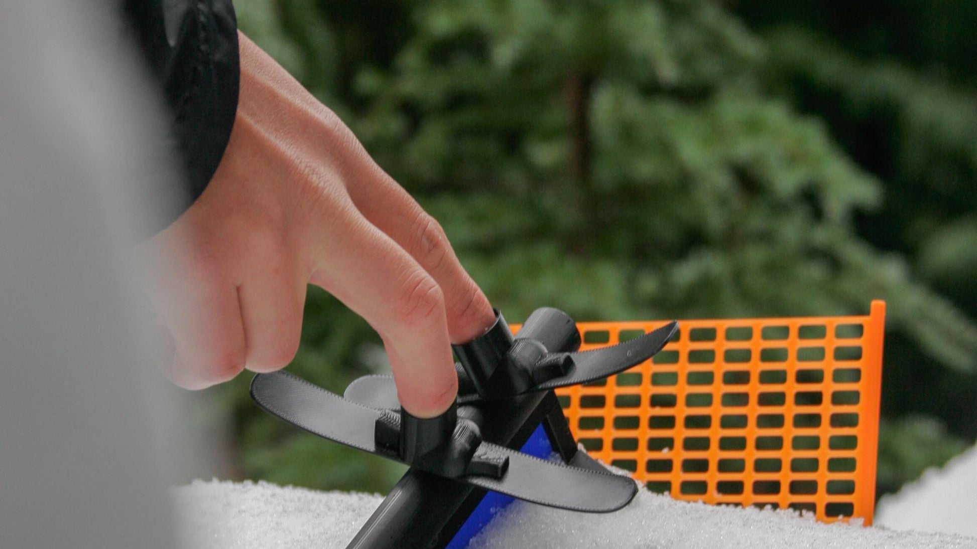 SlideofHand finger skis on a persons fingers sliding on a tube rail