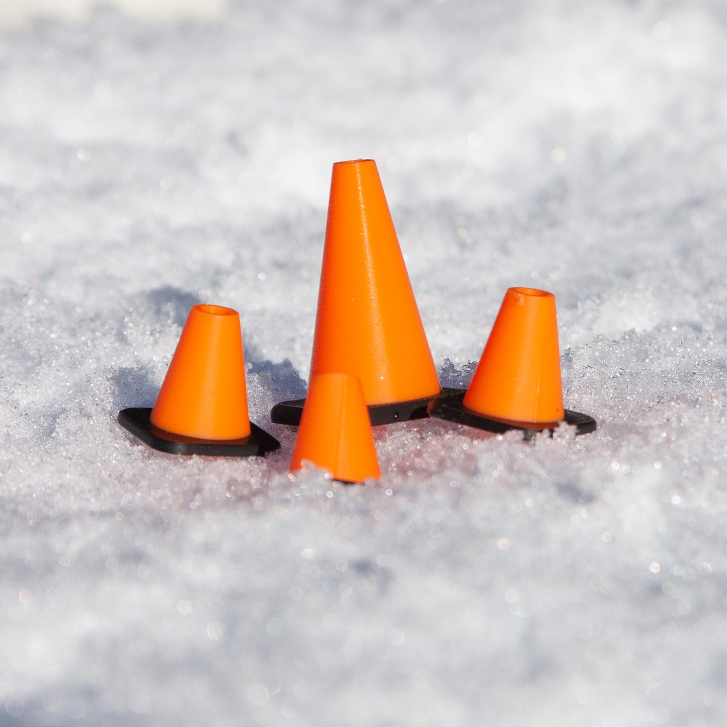 Slideofhand finger ski and snowboard cone accessory orange black in snow