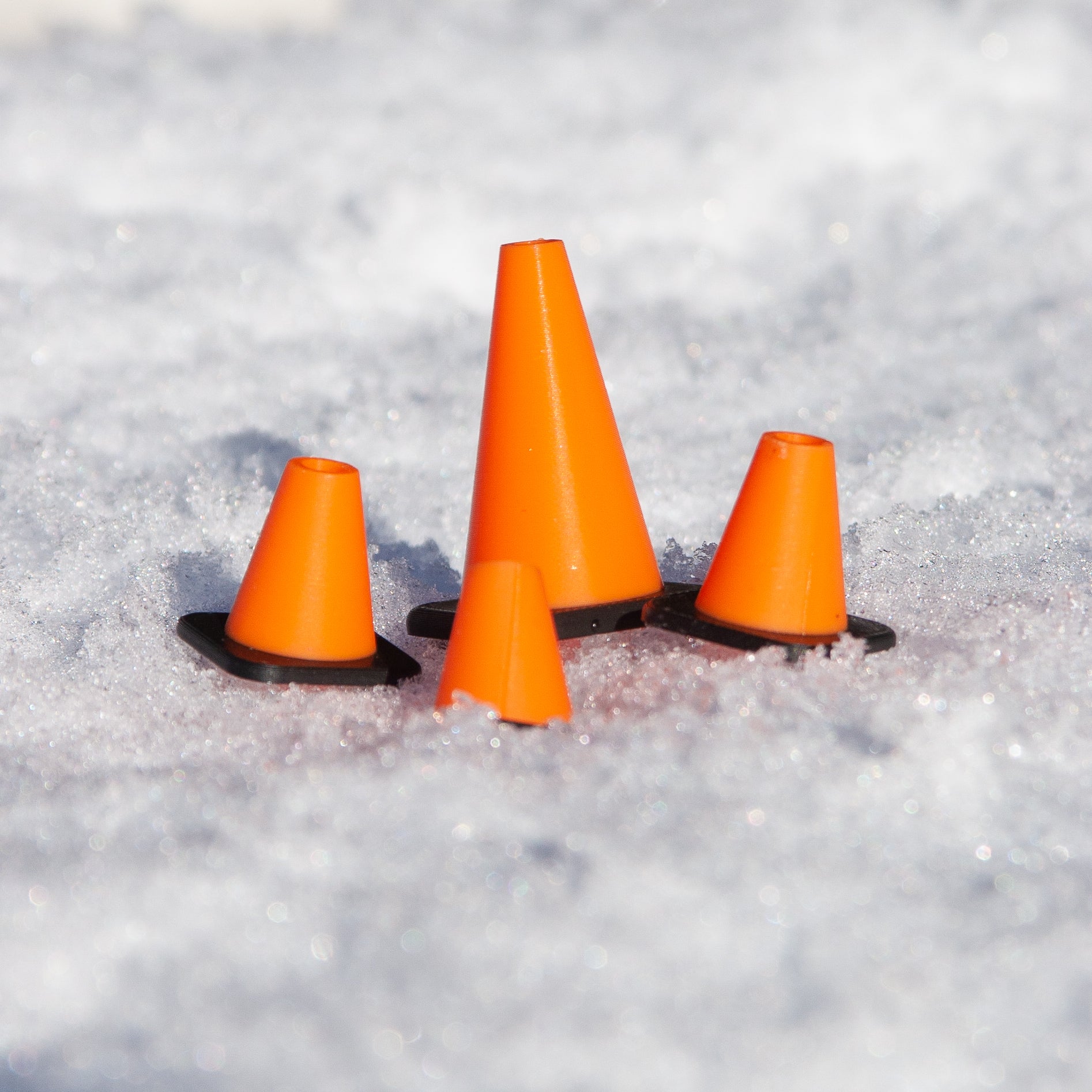 Slideofhand finger ski and snowboard cone accessory orange black in snow