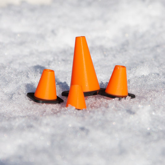 Slideofhand finger ski and snowboard cone accessory orange black in snow