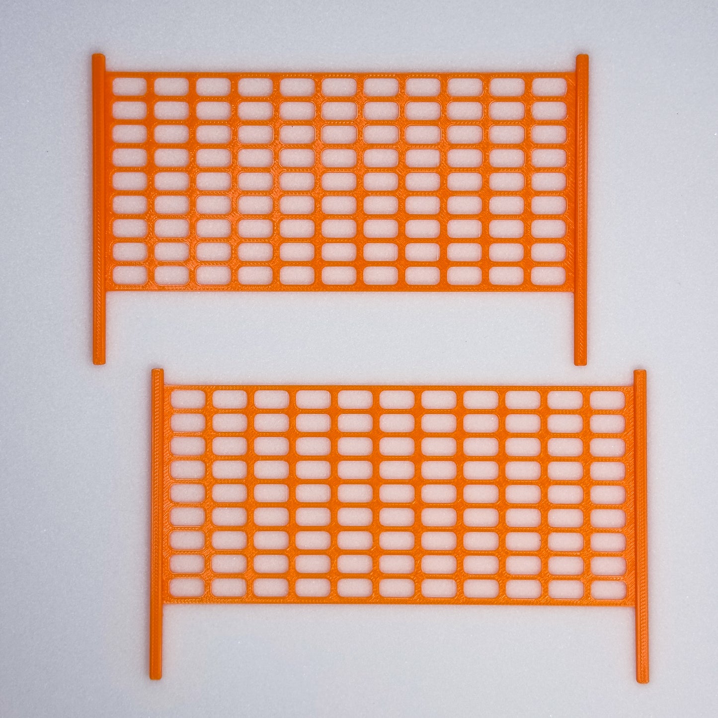 Slideofhand finger ski accessory safety netting orange gray background