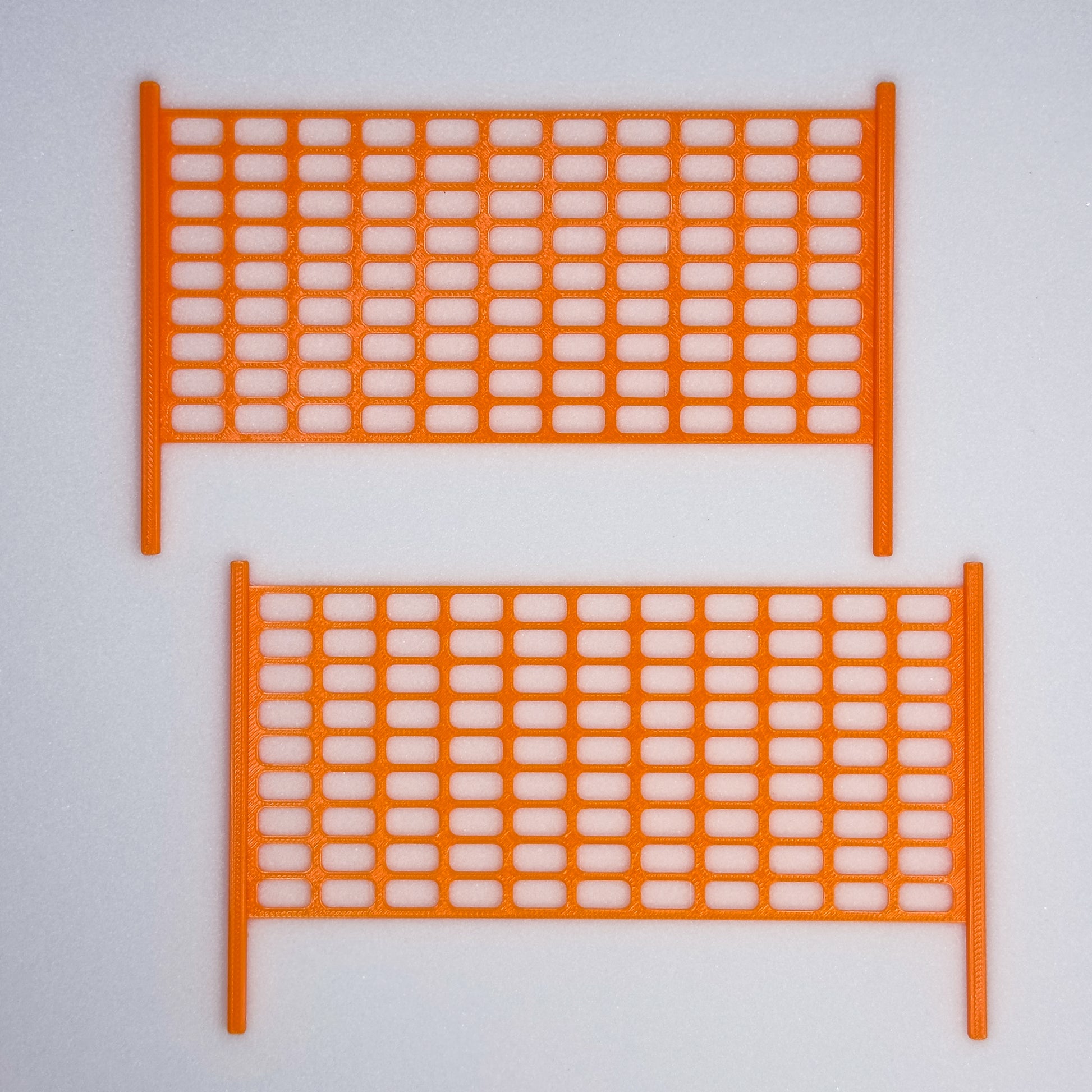 Slideofhand finger ski accessory safety netting orange gray background
