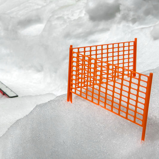 Slideofhand finger ski accessory safety netting orange in snow