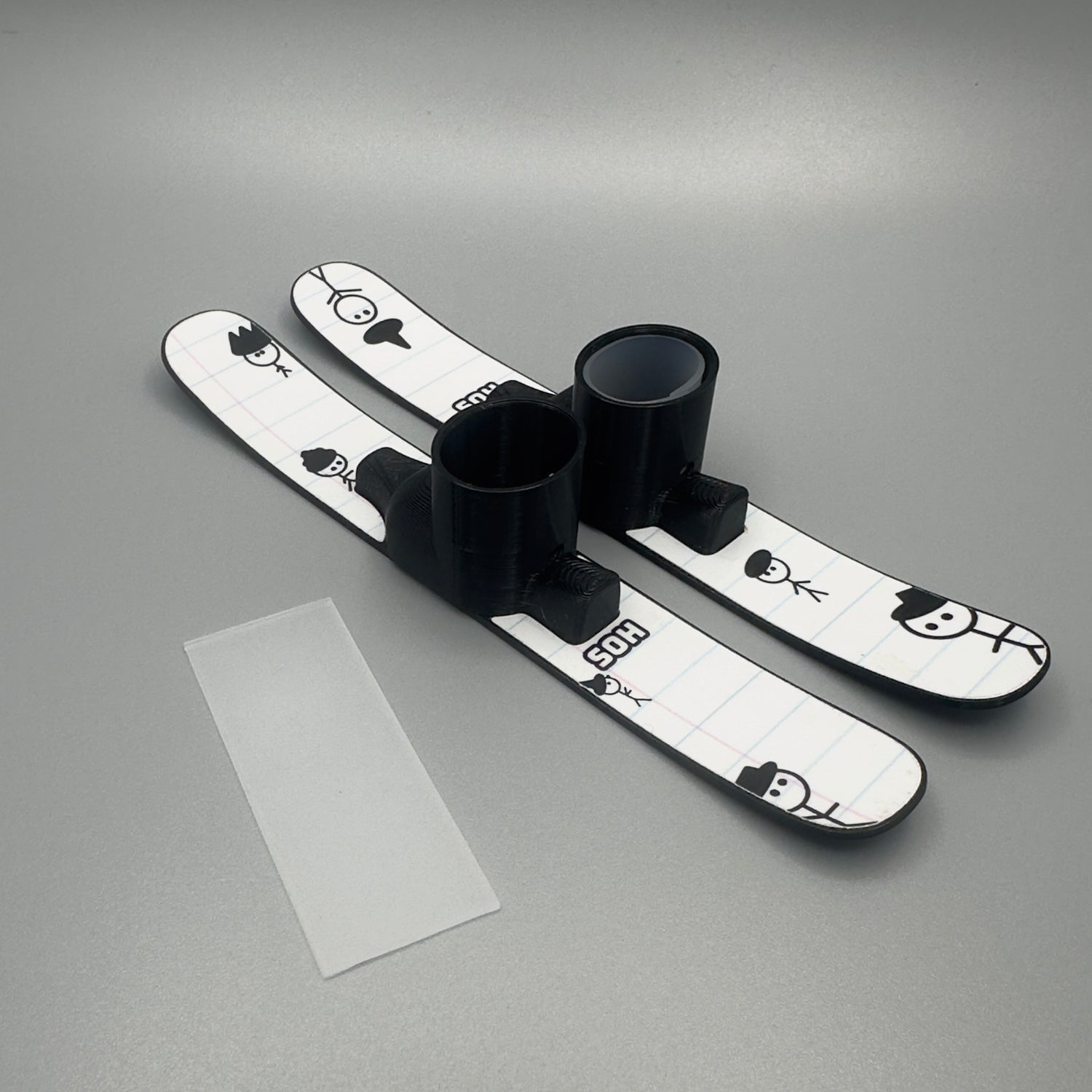 slideofhand finger skis with graphic topsheet next to silicone insert