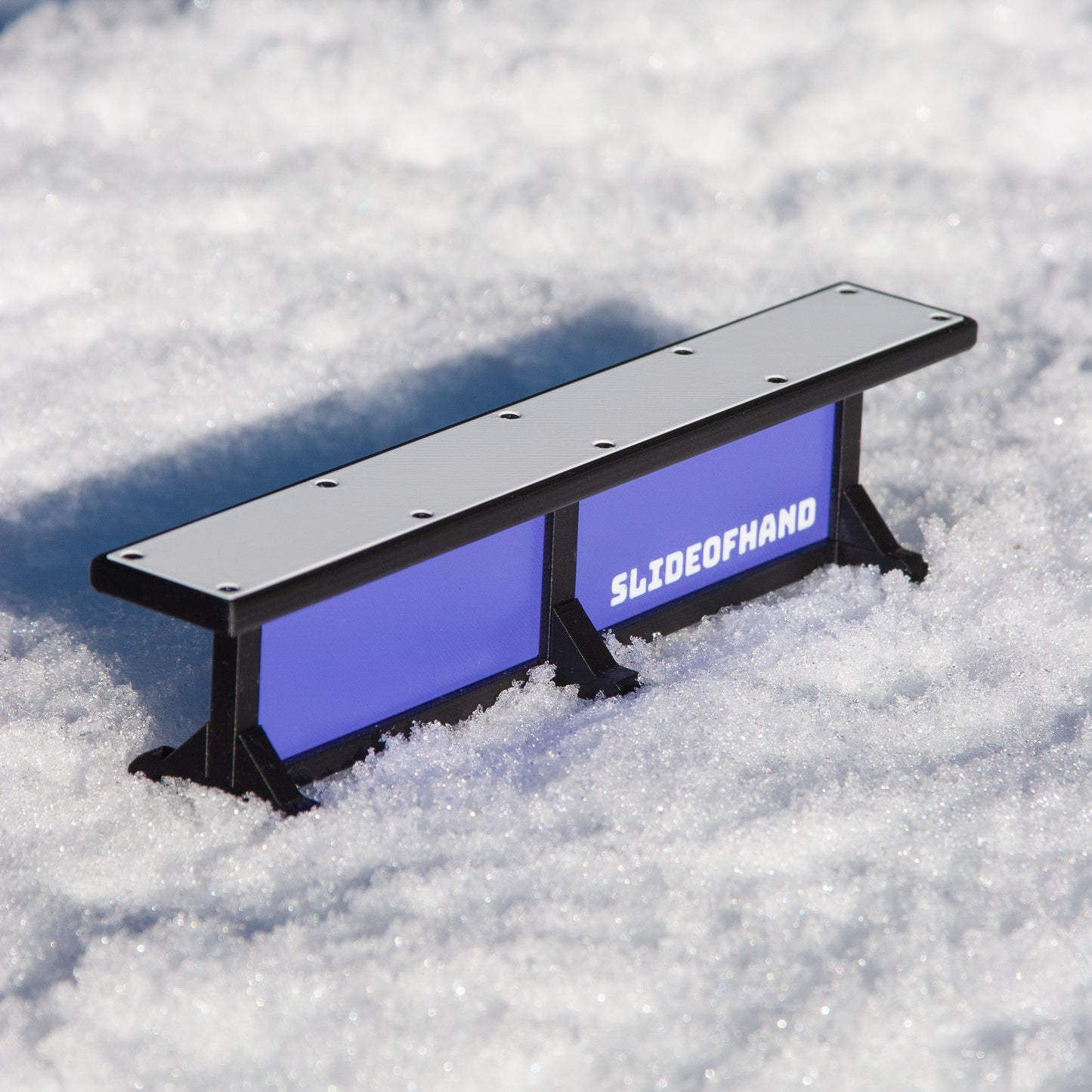 Slideofhand finger ski and snowboard terrrain park box rail accessory purple in snow