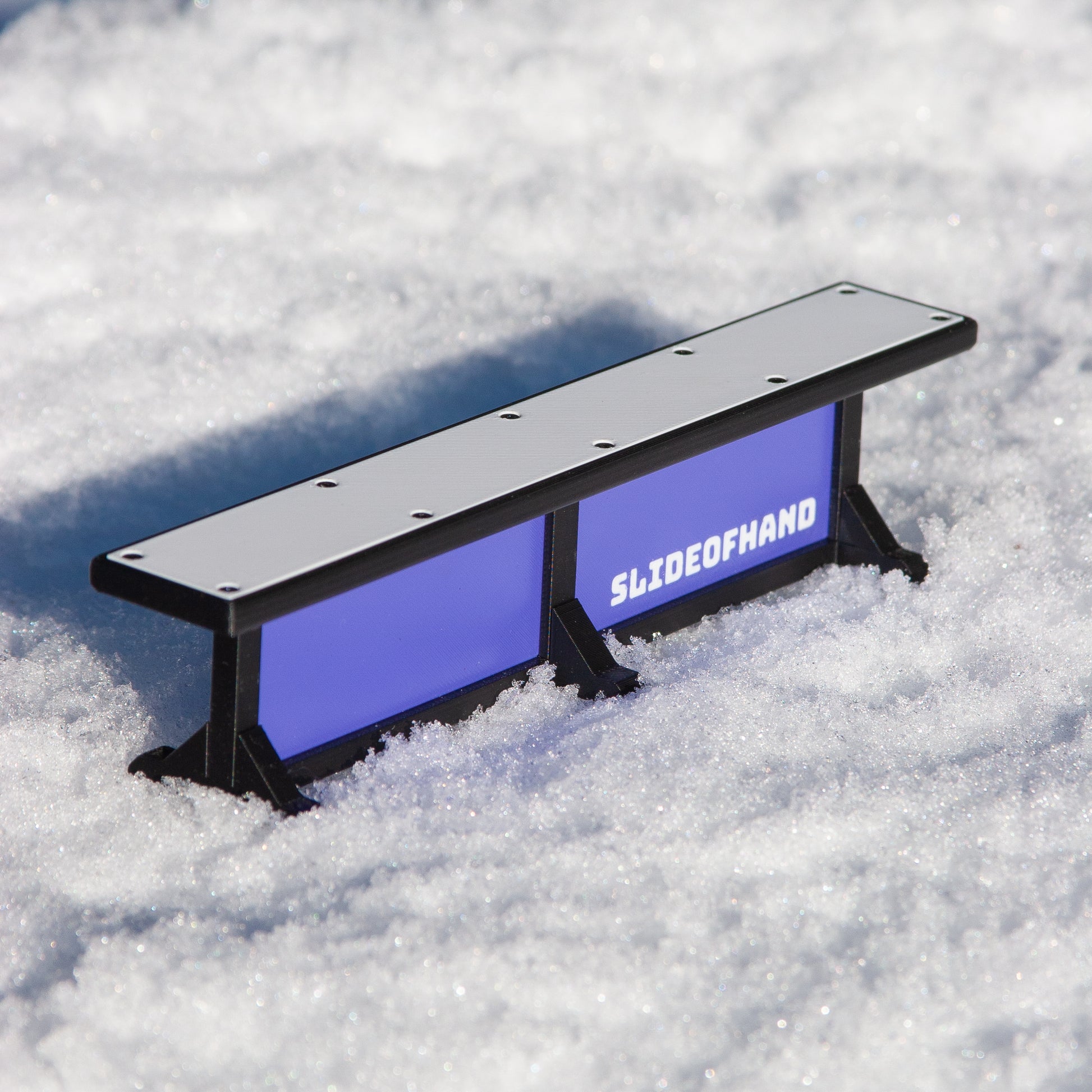 Slideofhand finger ski and snowboard terrrain park box rail accessory purple in snow