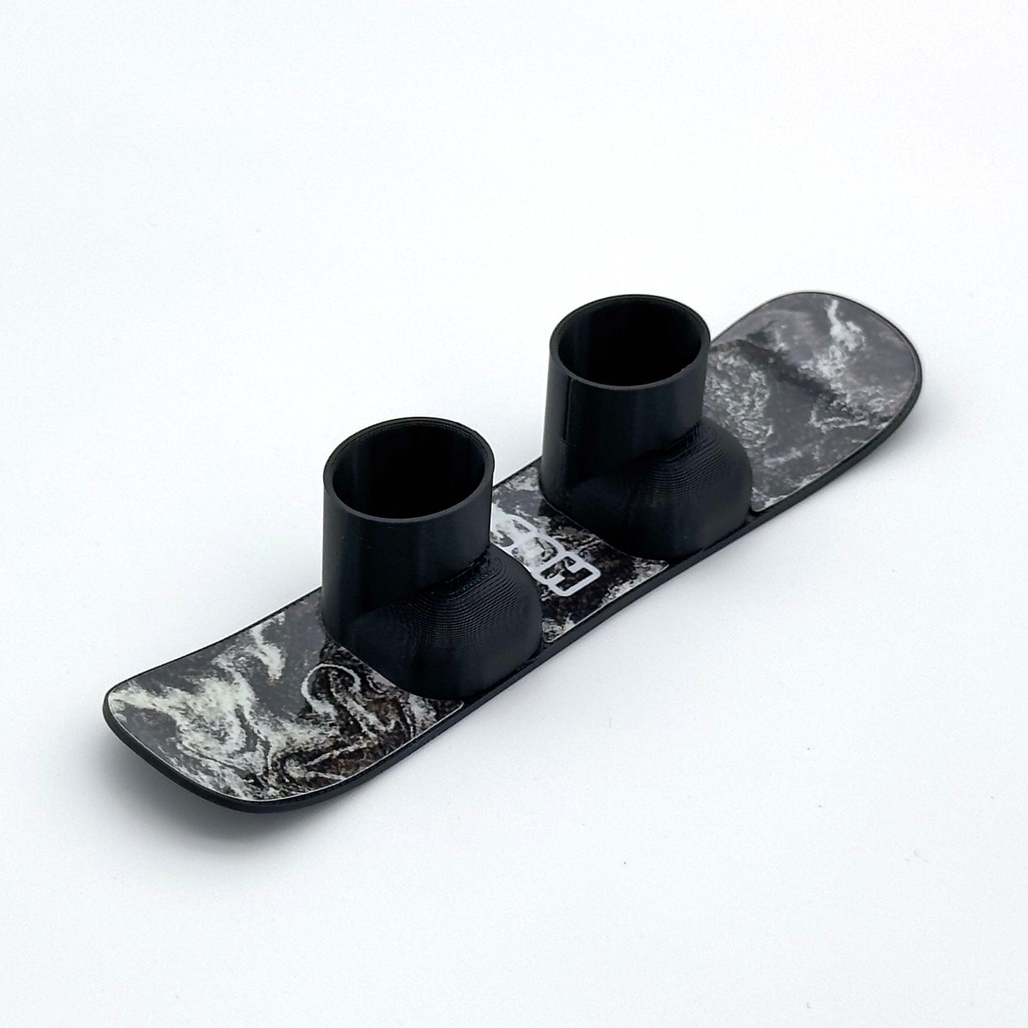 SlideofHand Finger Snowboard black with black and white pollen puddle graphic on a white background