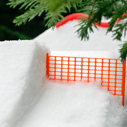slideofhand safety fencing for finger skis in the snow next to a jump