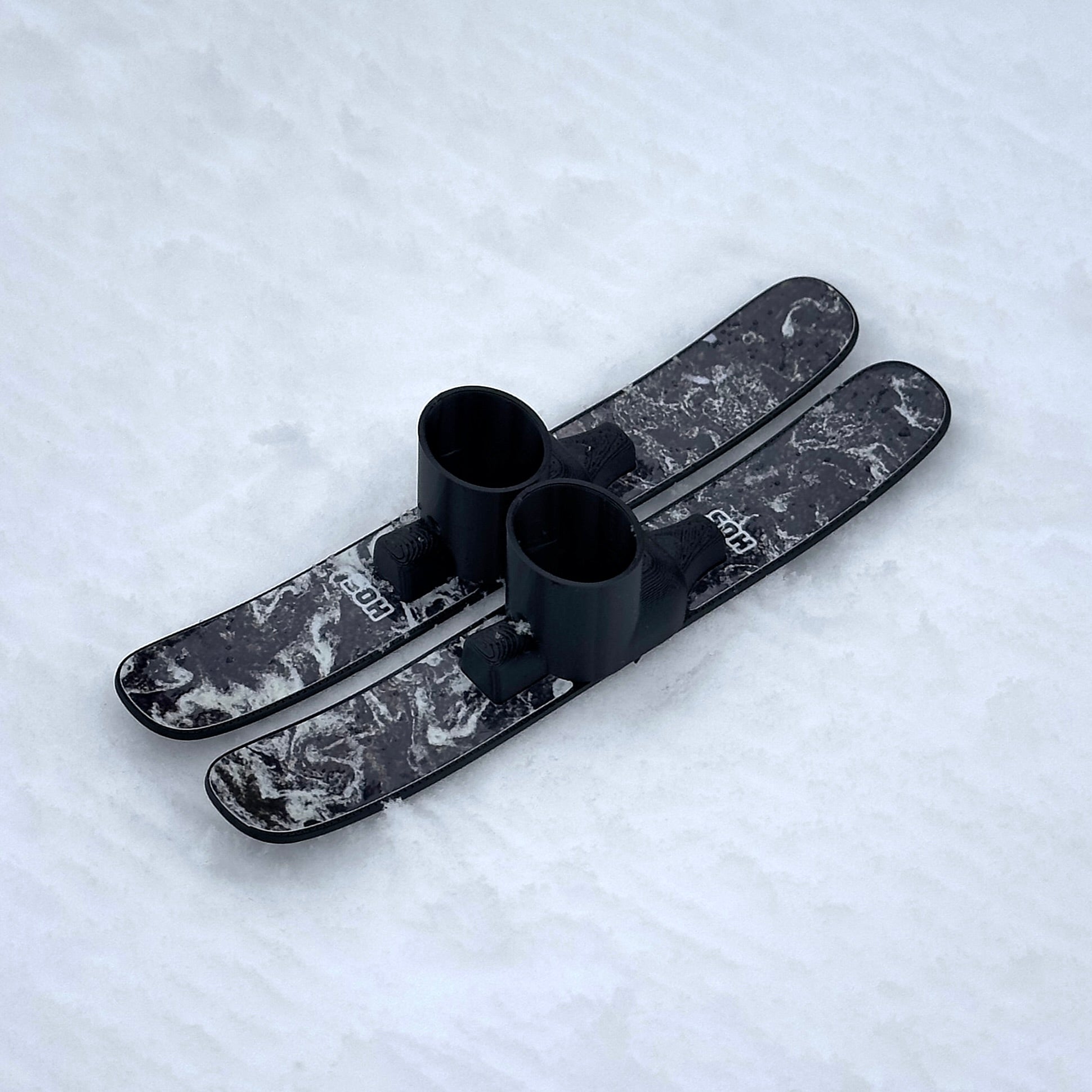 SlideofHand Finger Skis Pollen Graphic top down sitting on snow