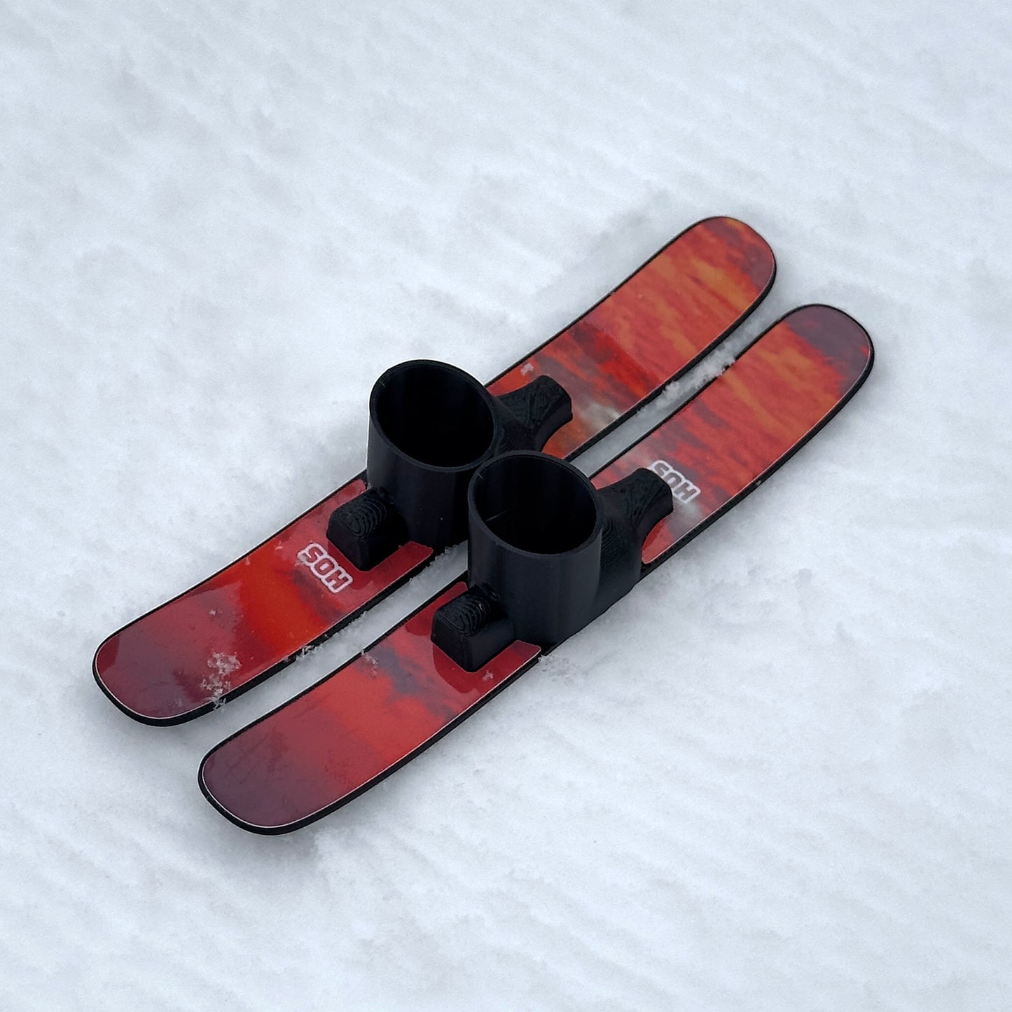 SlideofHand Finger Skis Sunrise Graphic top down view on snowy background