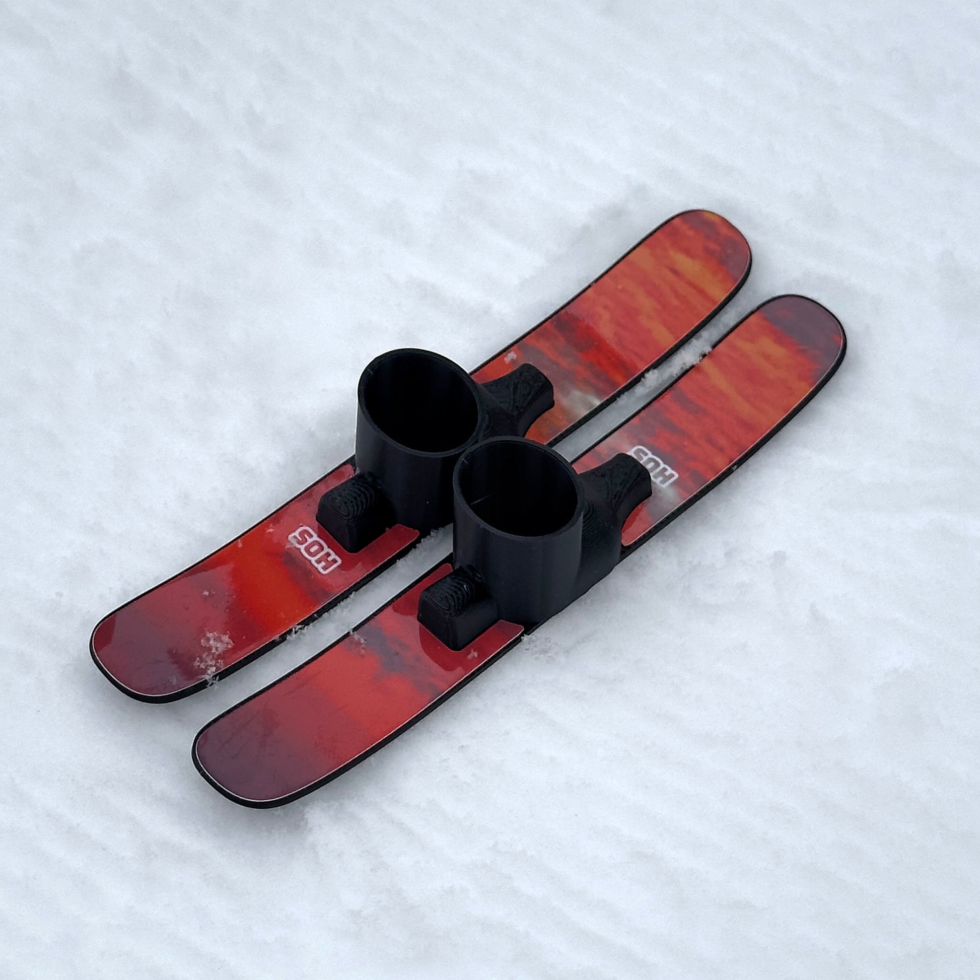 SlideofHand Finger Skis Sunrise Graphic top down view on snowy background