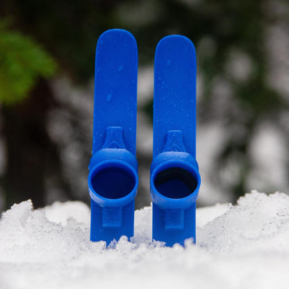 SlideofHand Finger Skis Blue sitting in snow with trees in background